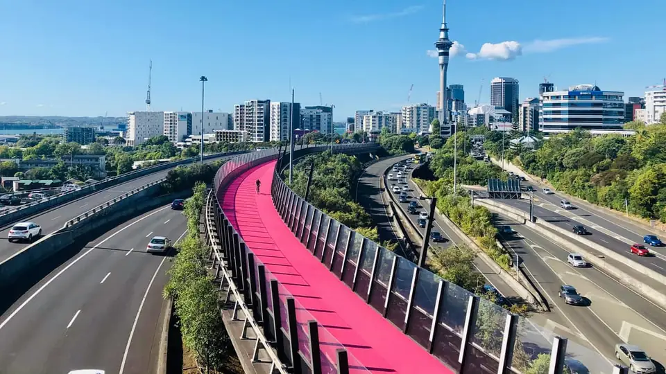 The Sky Tower and the pink Lightpath cycleway in Auckland