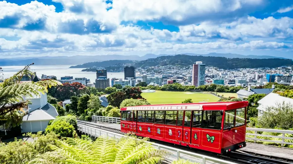 The red Wellington Cable Car above the city and harbour